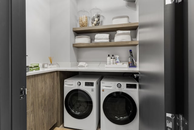 washroom with independent washer and dryer