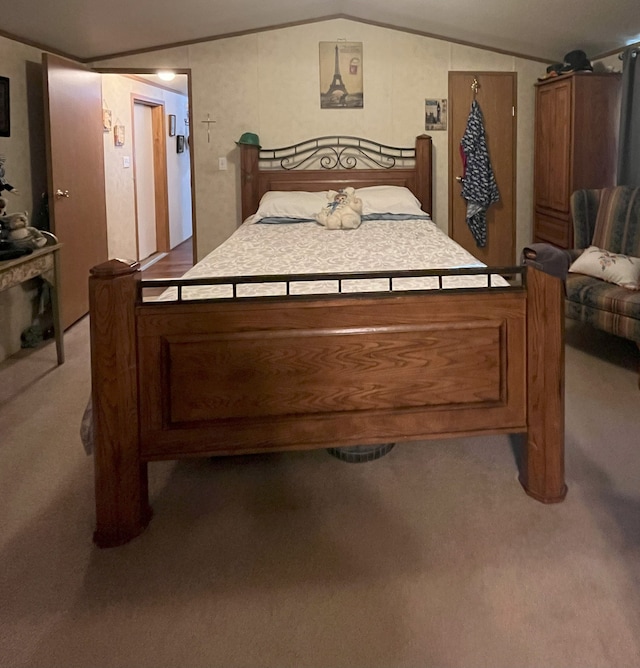 bedroom with carpet and lofted ceiling