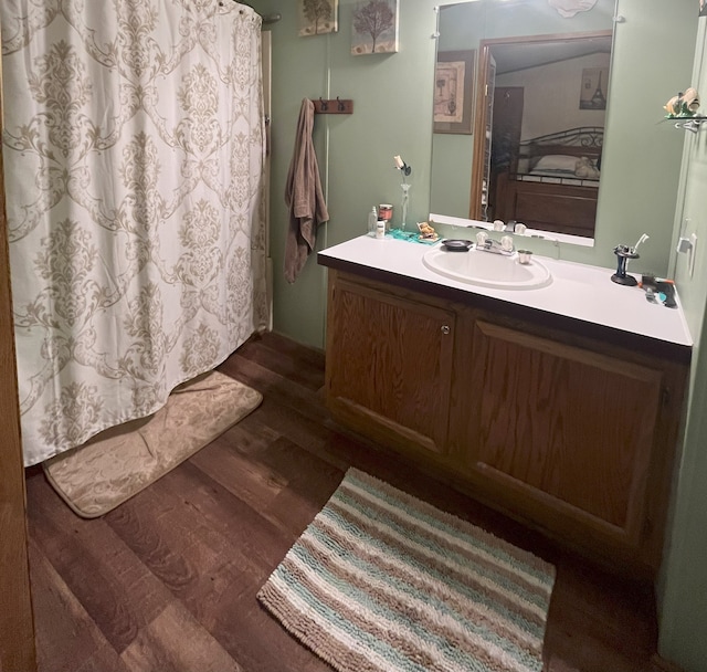 bathroom featuring vanity and hardwood / wood-style flooring