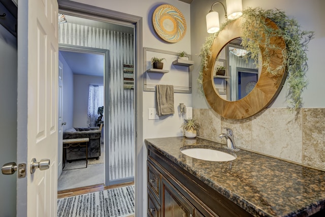 bathroom featuring decorative backsplash and vanity