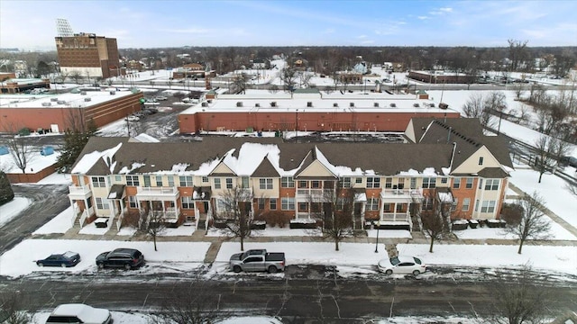 snowy aerial view featuring a residential view