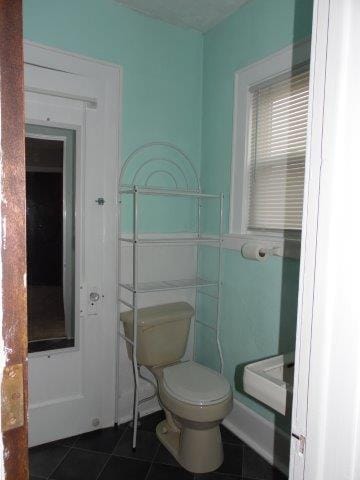 bathroom featuring tile patterned floors and toilet