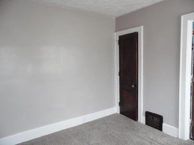 empty room featuring carpet flooring