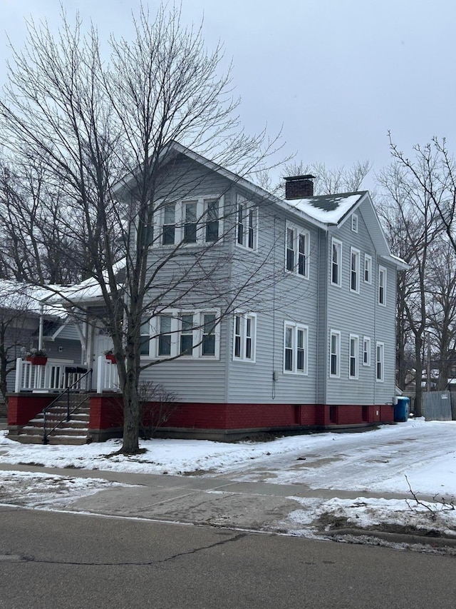 view of snow covered property