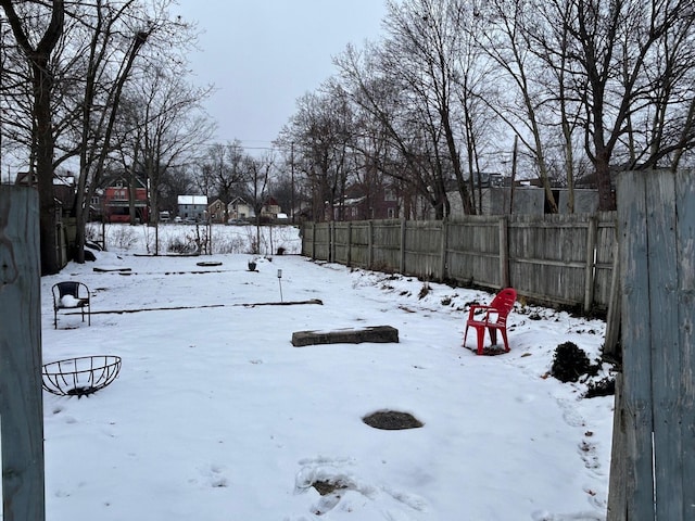 view of yard covered in snow