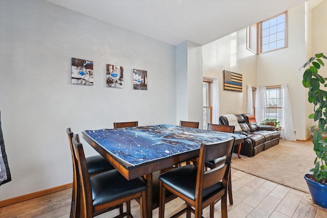 dining area with light hardwood / wood-style floors