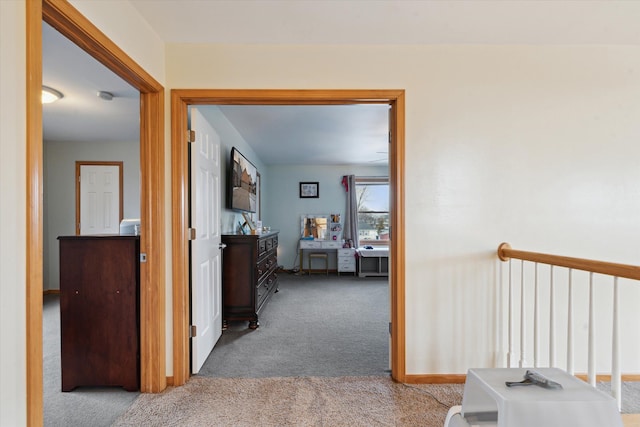 hallway with carpet flooring