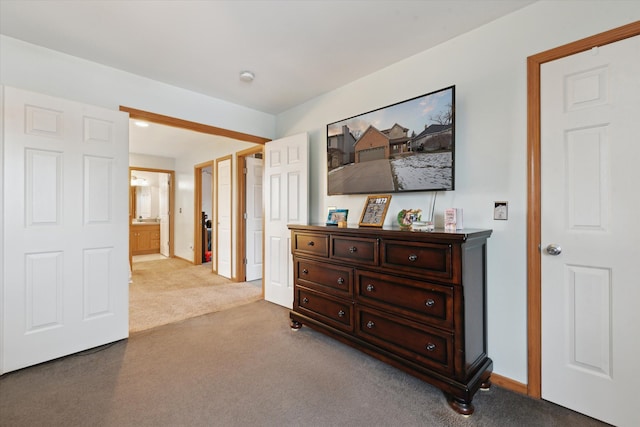 hallway featuring light colored carpet