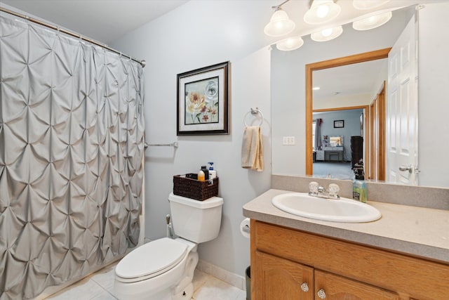 bathroom with vanity, toilet, curtained shower, and tile patterned flooring