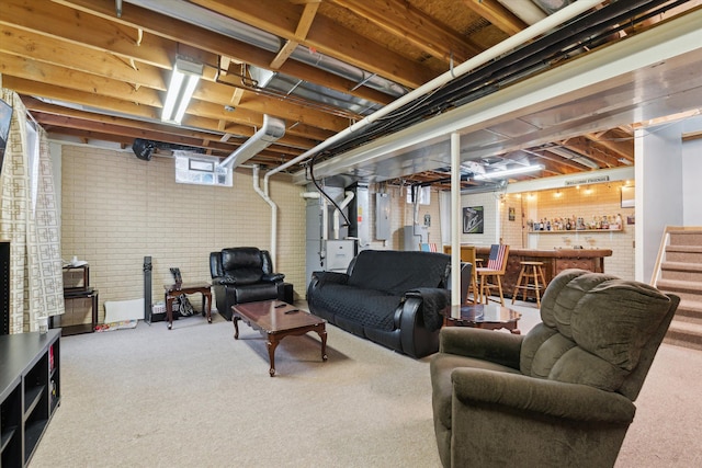 living room featuring carpet floors, bar area, electric panel, and heating unit