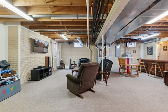 basement with brick wall, bar area, electric panel, and carpet flooring