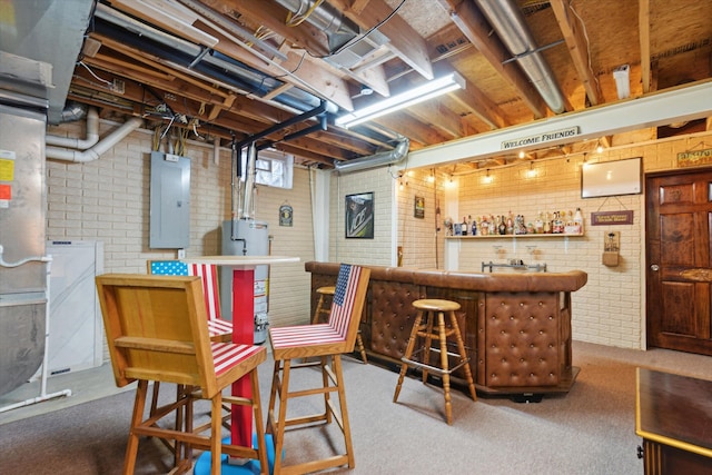 bar featuring brick wall, electric panel, and carpet