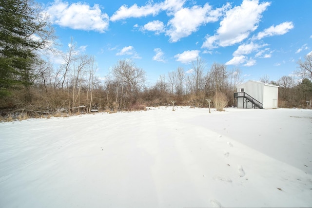 view of yard layered in snow