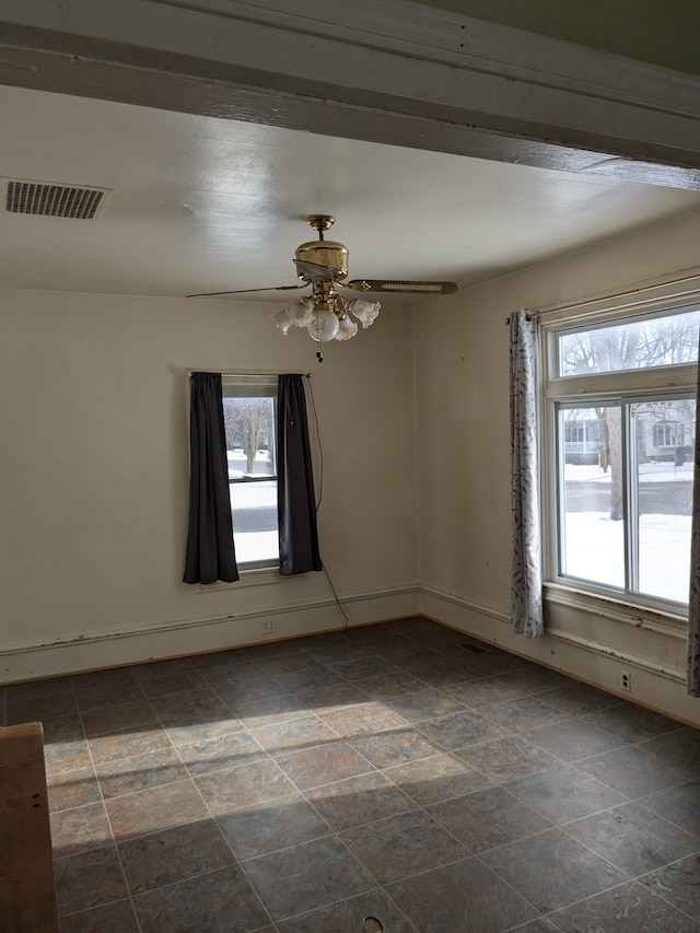 unfurnished room with ceiling fan