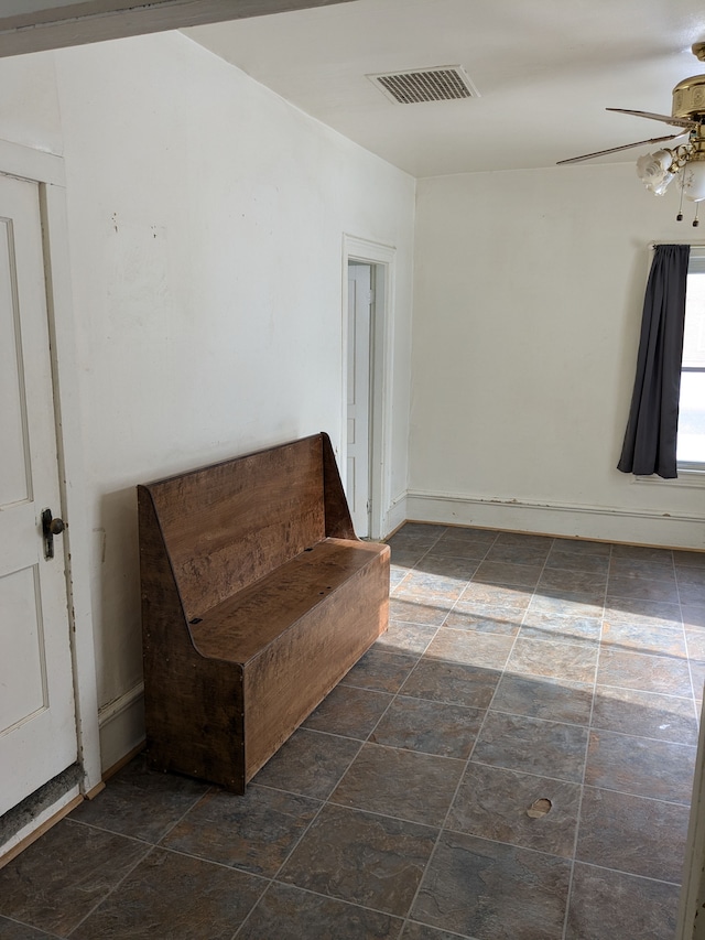 unfurnished room featuring ceiling fan