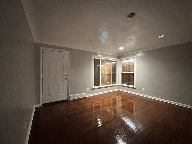 spare room with hardwood / wood-style flooring