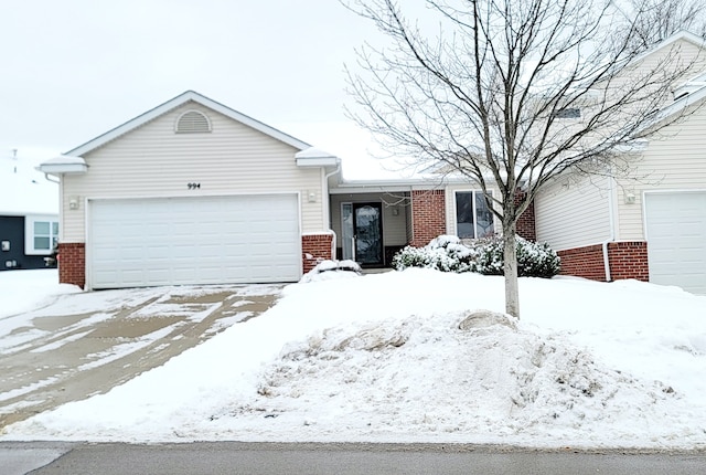 ranch-style house featuring a garage