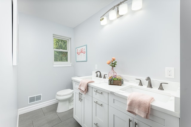 bathroom with toilet and vanity