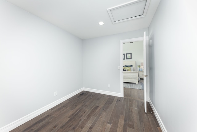 spare room featuring dark hardwood / wood-style flooring