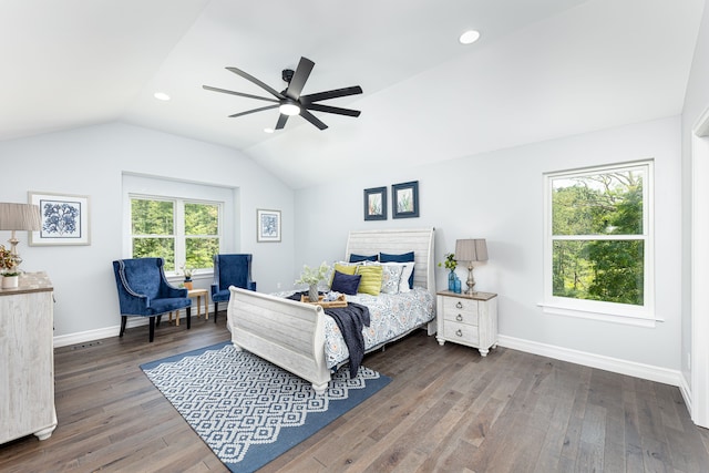 bedroom with ceiling fan, dark hardwood / wood-style flooring, and lofted ceiling