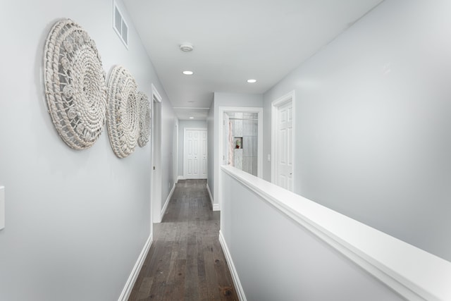 hall with dark wood-type flooring