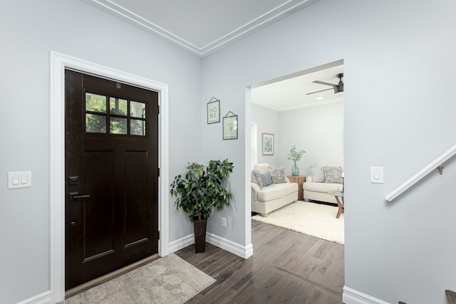 foyer featuring ceiling fan and dark wood-type flooring