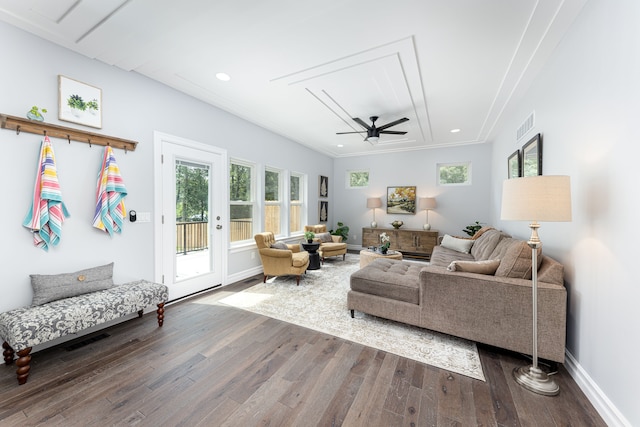 living room featuring ceiling fan, wood-type flooring, and plenty of natural light