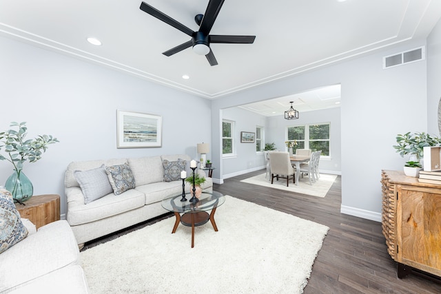 living room with ceiling fan and dark hardwood / wood-style flooring