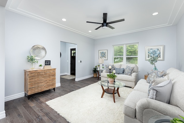 living room with ceiling fan and dark hardwood / wood-style floors