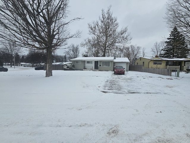 view of front of property featuring a garage and a porch