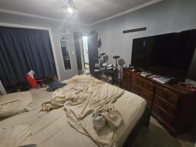 bedroom with a textured ceiling, ornamental molding, a chandelier, and carpet flooring