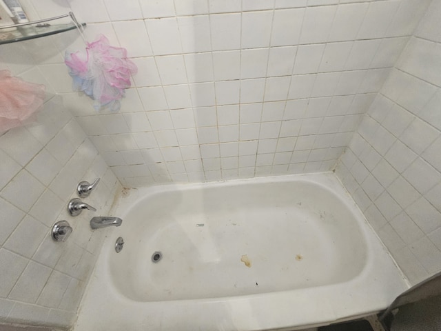 bathroom featuring a tub to relax in