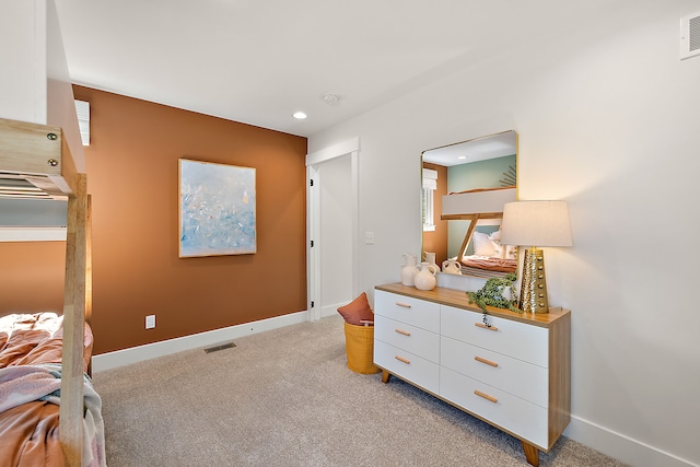 bedroom with light colored carpet