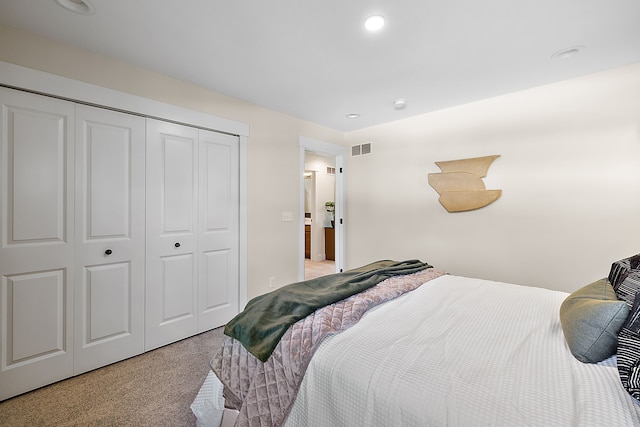 carpeted bedroom featuring a closet