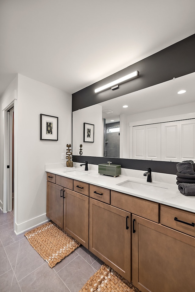 bathroom featuring vanity, tile patterned flooring, and a shower with door