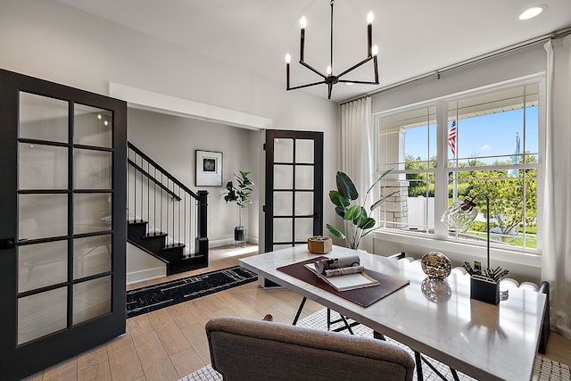 office featuring an inviting chandelier