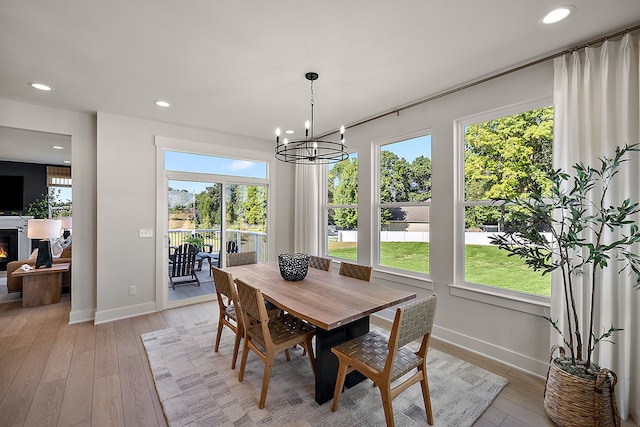 dining room featuring a chandelier and light hardwood / wood-style flooring