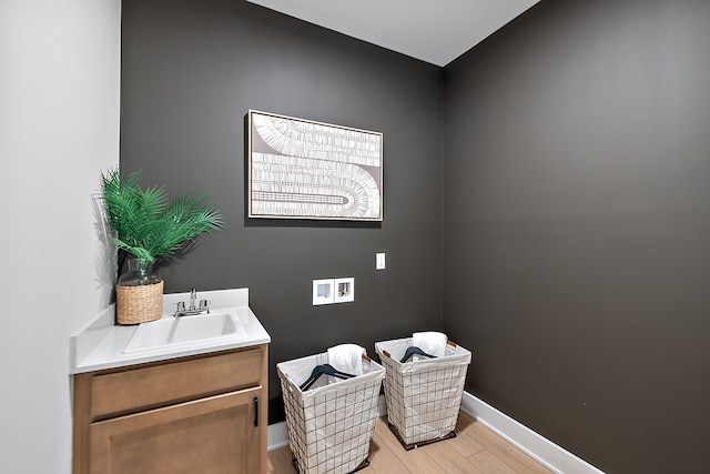 bathroom featuring hardwood / wood-style flooring and vanity