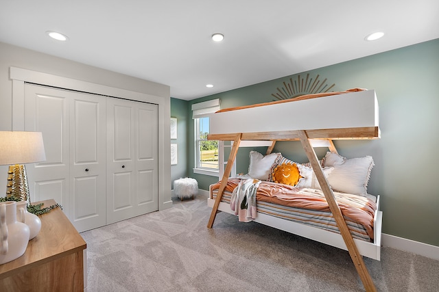 carpeted bedroom with a closet