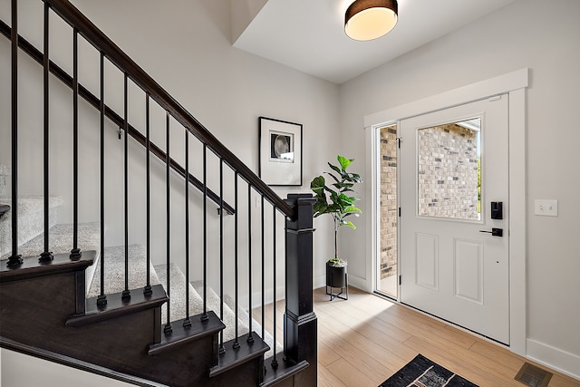 entryway with light hardwood / wood-style floors