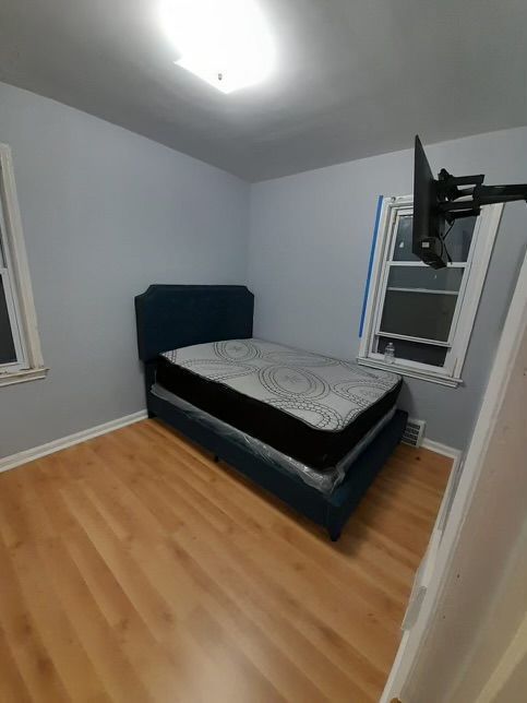 bedroom with hardwood / wood-style floors