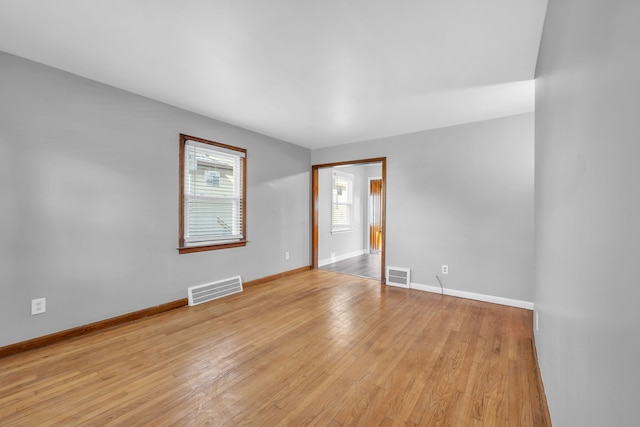 spare room with light hardwood / wood-style floors