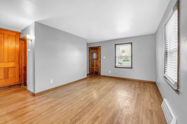 spare room with light wood-type flooring