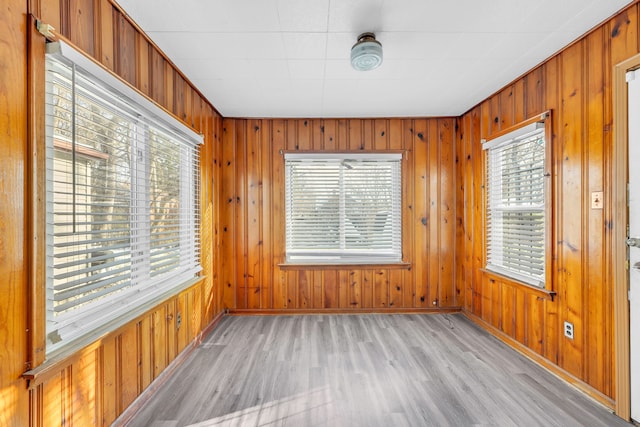 unfurnished sunroom featuring plenty of natural light