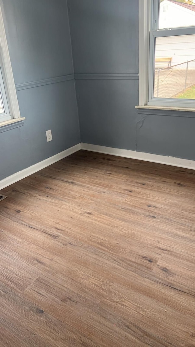 empty room featuring hardwood / wood-style flooring