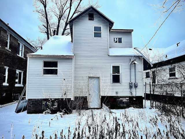 view of snow covered house