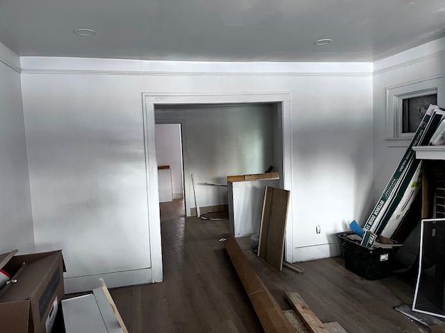 hallway featuring dark wood-type flooring