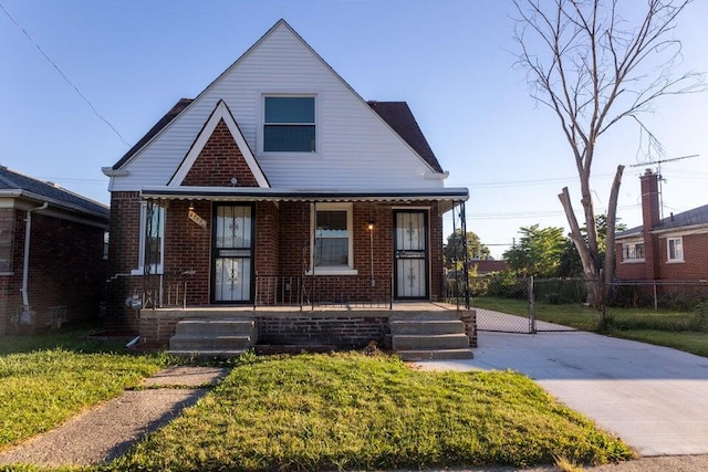 bungalow with a front lawn and a porch