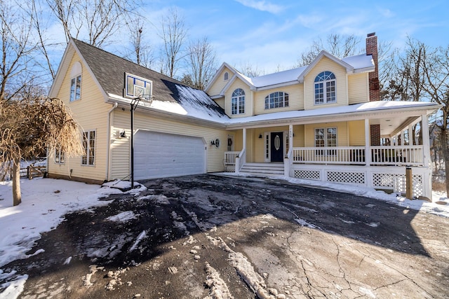 view of front of house featuring a garage and covered porch