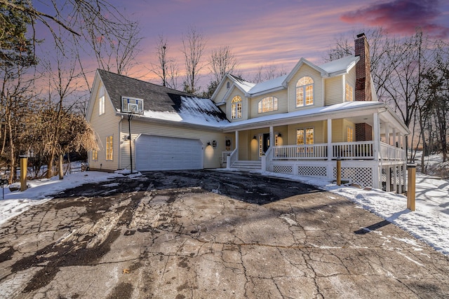 view of front of home with a garage and covered porch